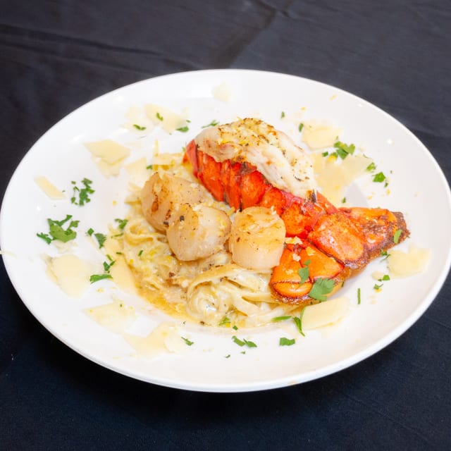 Citrus Cream Lobster Tail & Scallops Fettuccine.